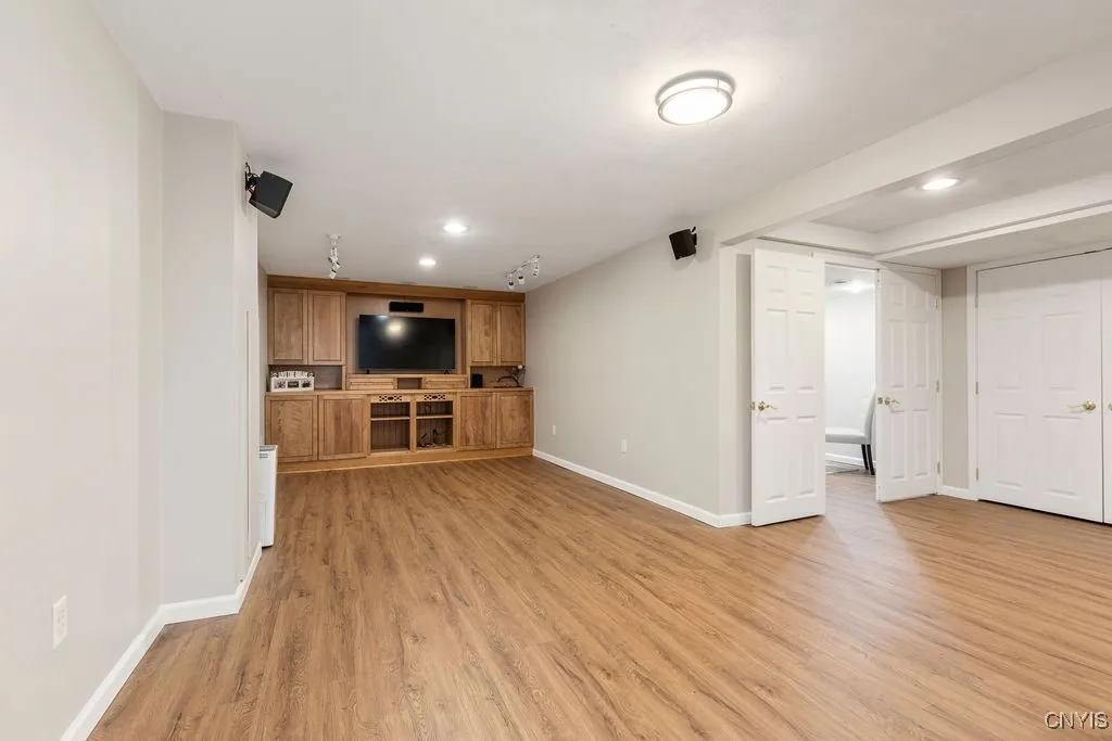 Built in basement cabinets with surround sound speakers