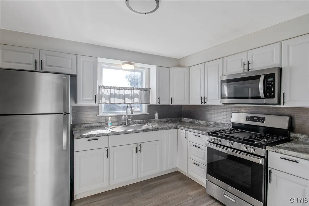 This shows a close-up of the stainless appliances and cabinetry