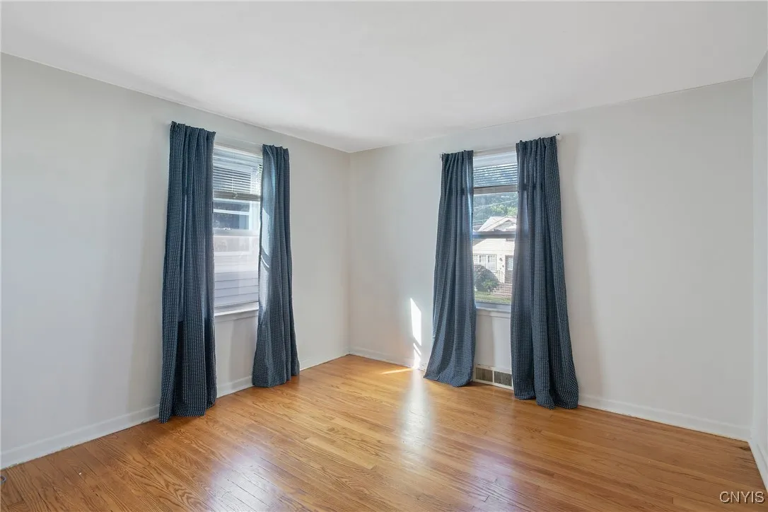 This is bedroom #1 on first floor-note the gleaming hardwoods!