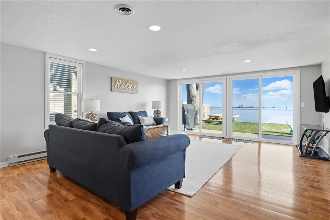 Bright open living area with large sliding glass and natural light.