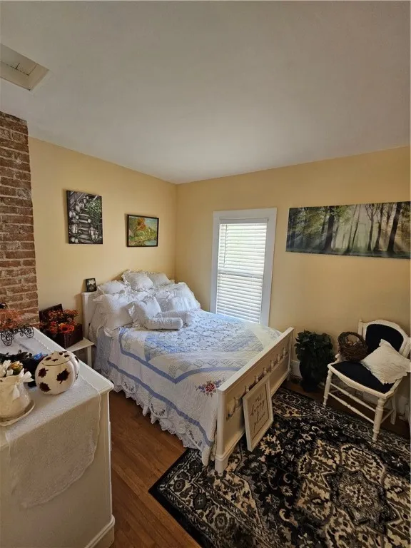 Beautiful exposed brick in this bedroom