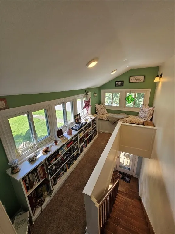 Amazing library with sitting area. Custom cushions stay, and there's storage under the cushion.