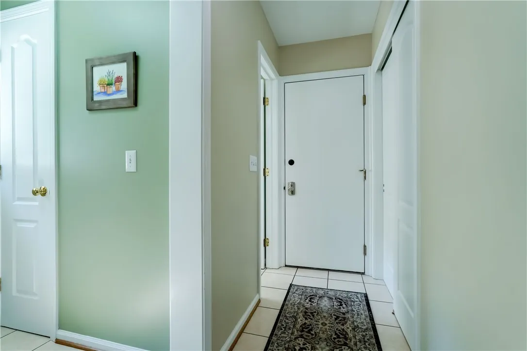Enter from the garage- back hall way, convenient to the 1/2 bath and laundry room. Large coat closet!