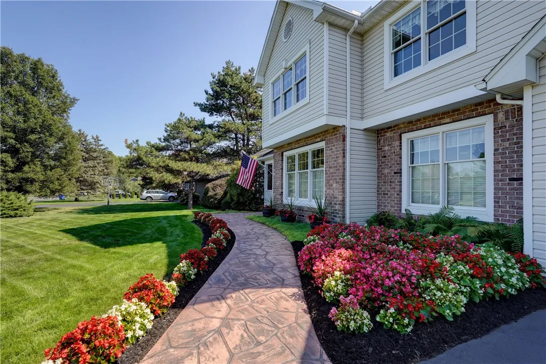 Stamped concrete walk way & inviting landscape!