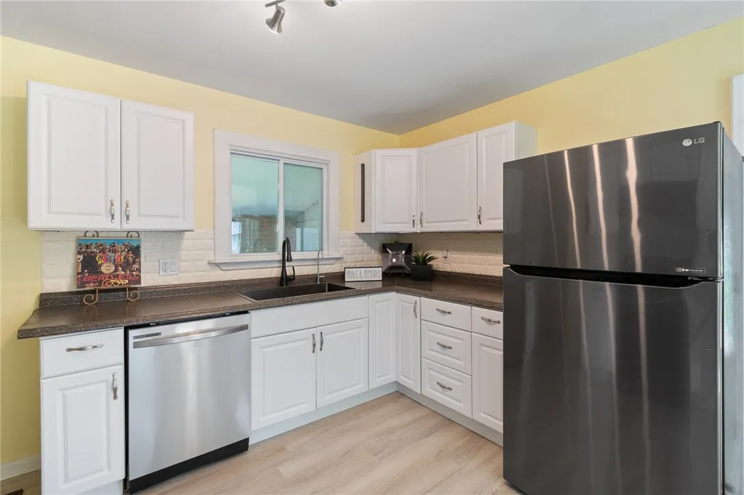 Appliances stay! Enjoy this OPEN FLOOR PLAN style - easy care floors too!
