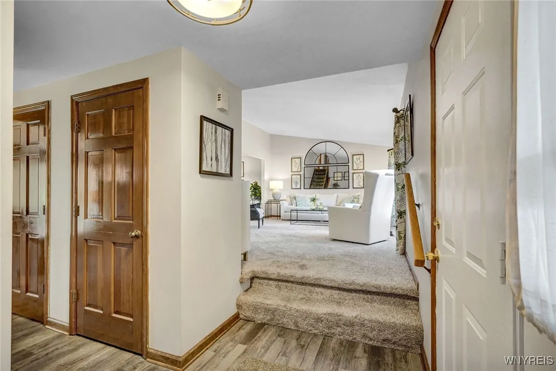 Spacious foyer looks into living room