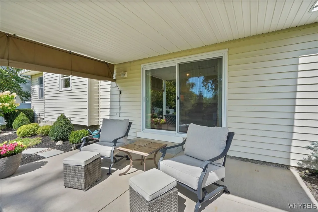 Exit the newer Andersen doors to your covered back patio with custom sun screen