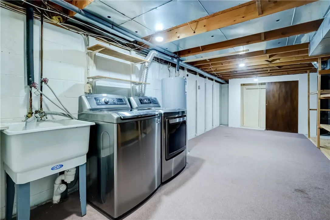 Basement laundry area and storage: Utility sink, plenty of room for storage. Washer and dryer included.