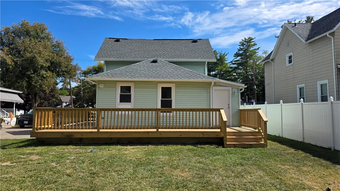 Back of home with deck