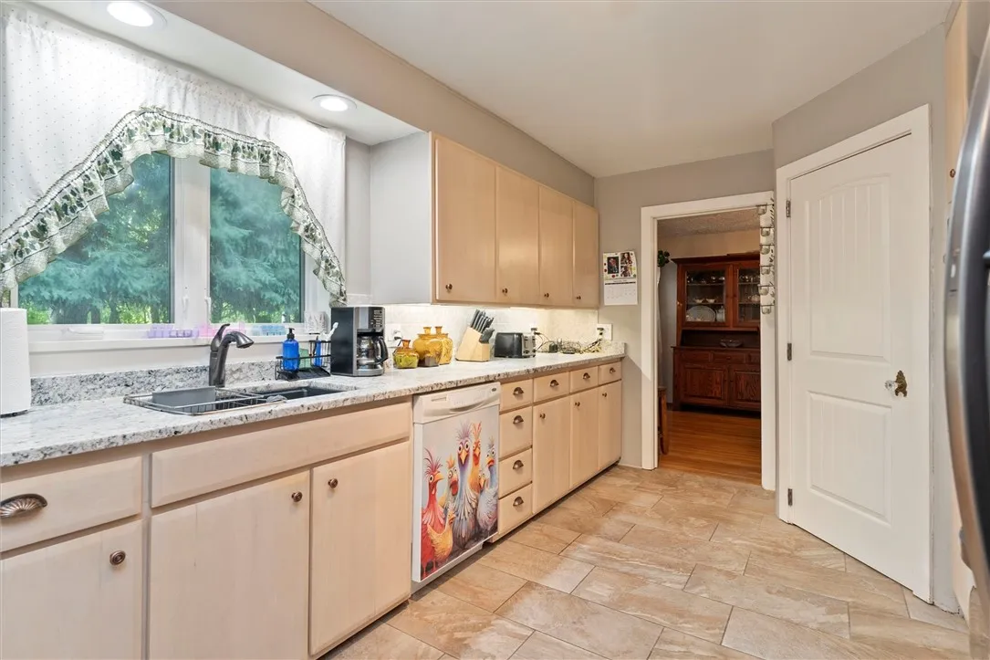 kitchen facing dining room and step in pantry