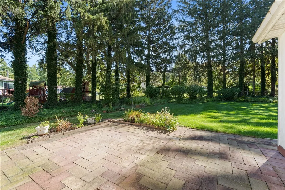 Large, paver patio off sunroom is perfect for entertaining!