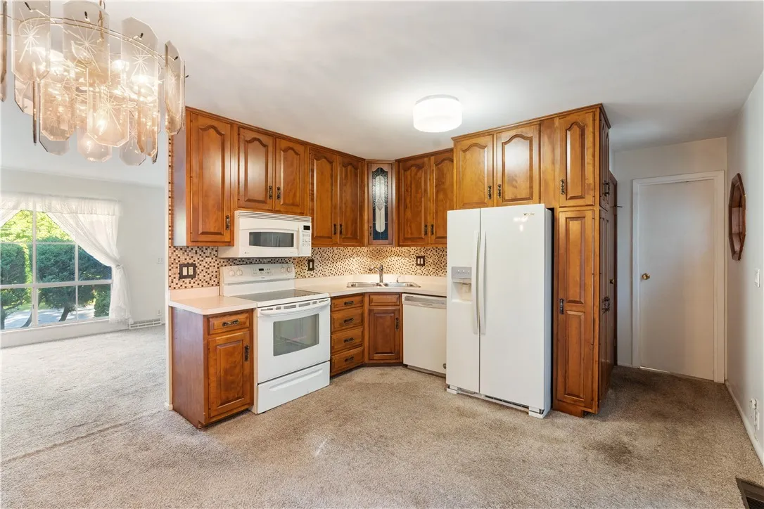 Eat-in kitchen w/tons of cabinet space & all appliances included.