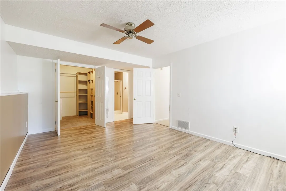View of Lower Level Walk-in Closet and Full Bathroom