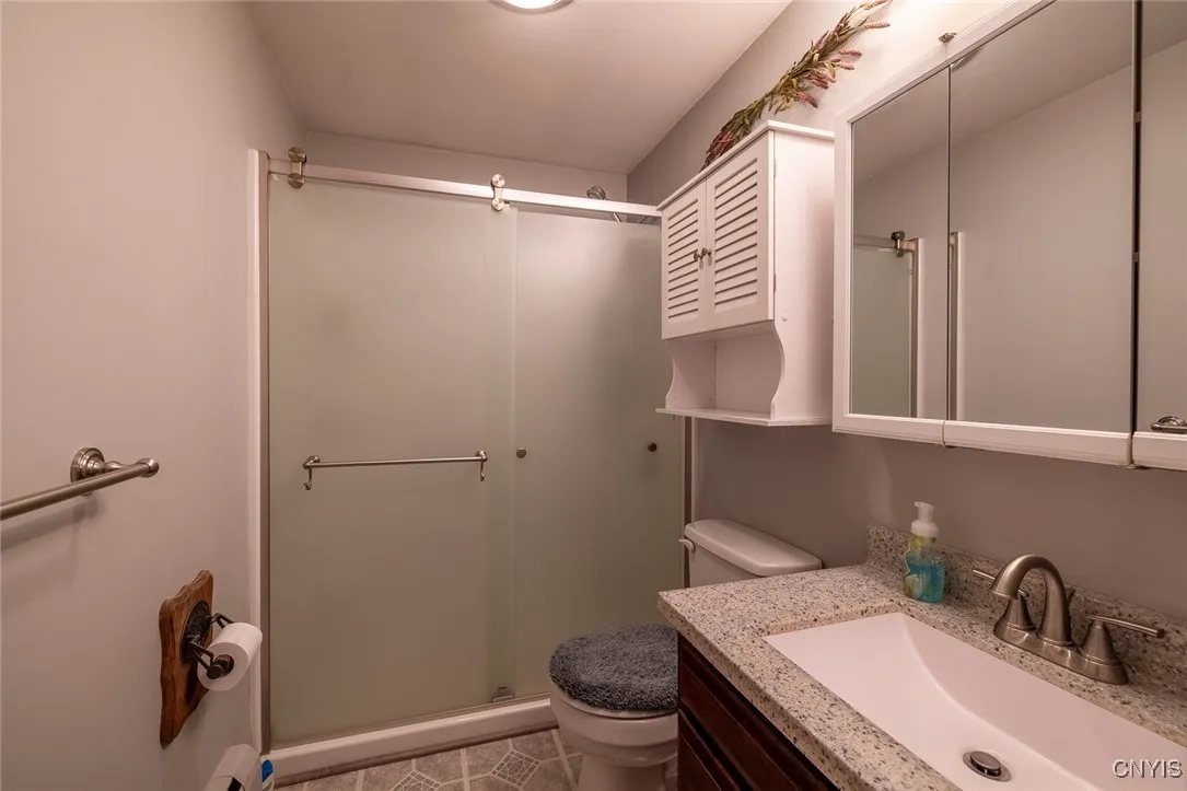 Second floor full bathroom with a walk-in shower.