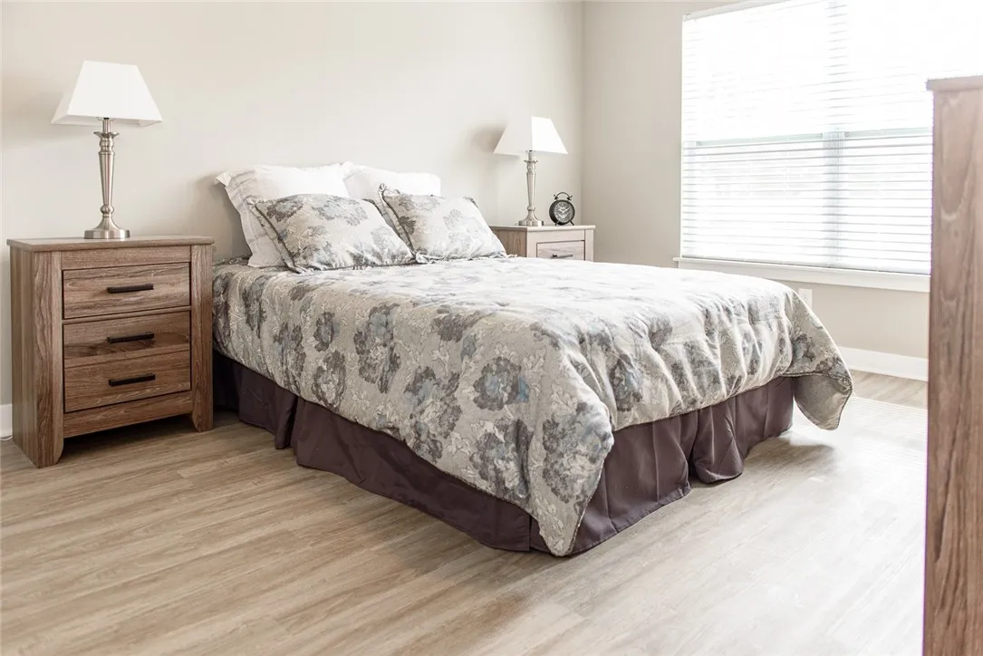 Typical bedroom with plank flooring