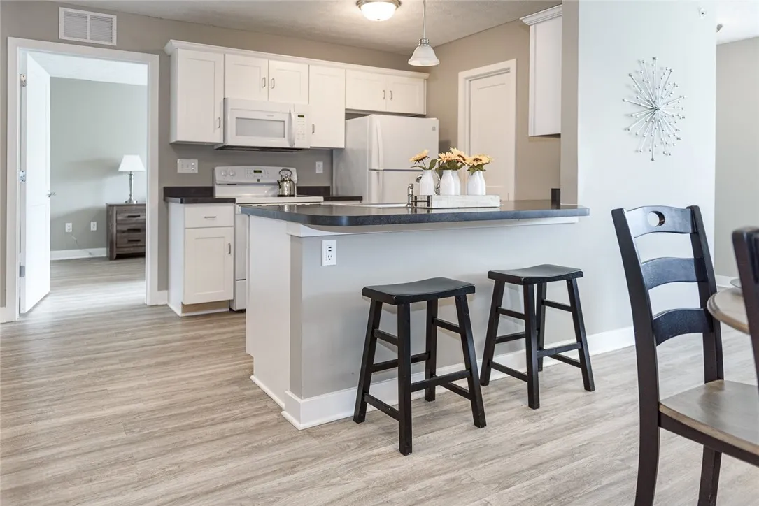 Typical kitchen with breakfast bar & pantry