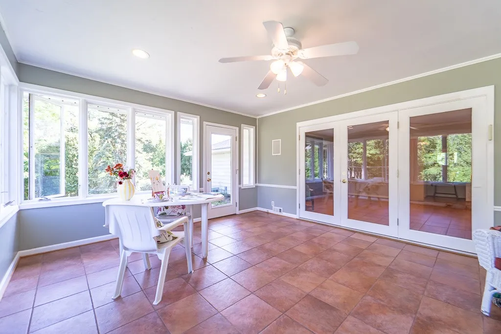 This magnificent year-round feature boasts tile floor, ceiling fan and access to the vast rear yard.