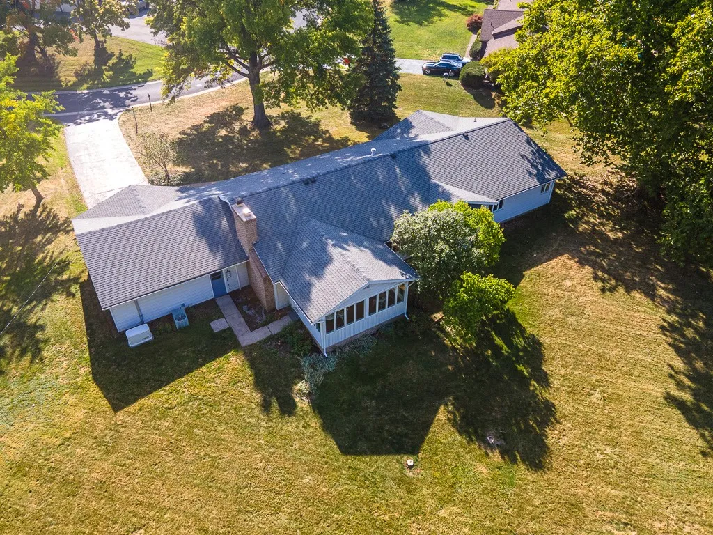 An attached two-car garage with access to both the front porch and rear yard and a full unfinished basement with abundant storage & an activity room awaiting finishing touches complete this home.