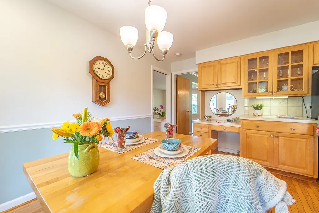 A cook's kitchen awaits with sun-filled eating area.