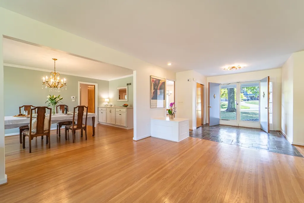 The open concept plan continues into the sprawling paneled family room.