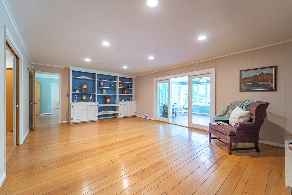 Glass doors open to the heated sunroom.