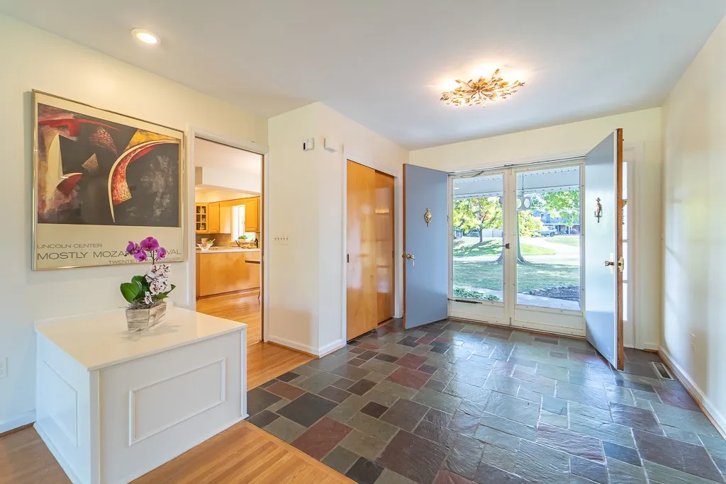 Step through double doors into the tiled foyer with coat closet.