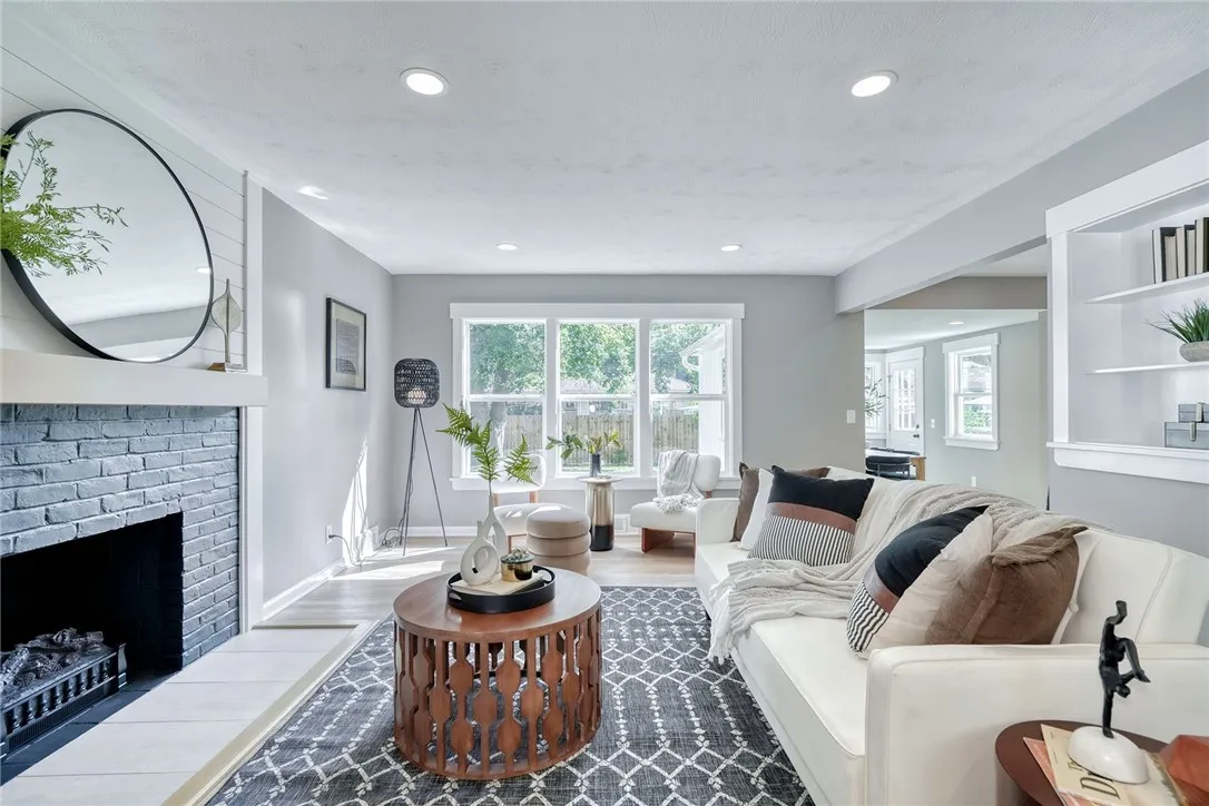 Open concept living anchored by a stylish fireplace feature wall