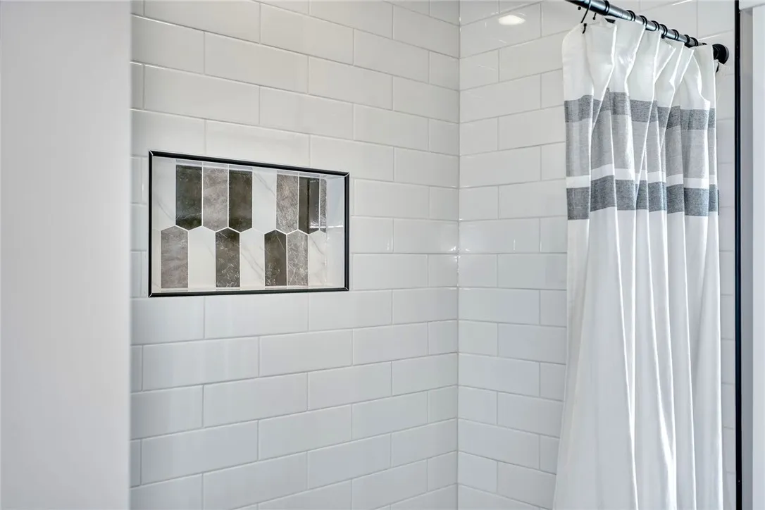 Custom tile details bring style to the brand-new full bath