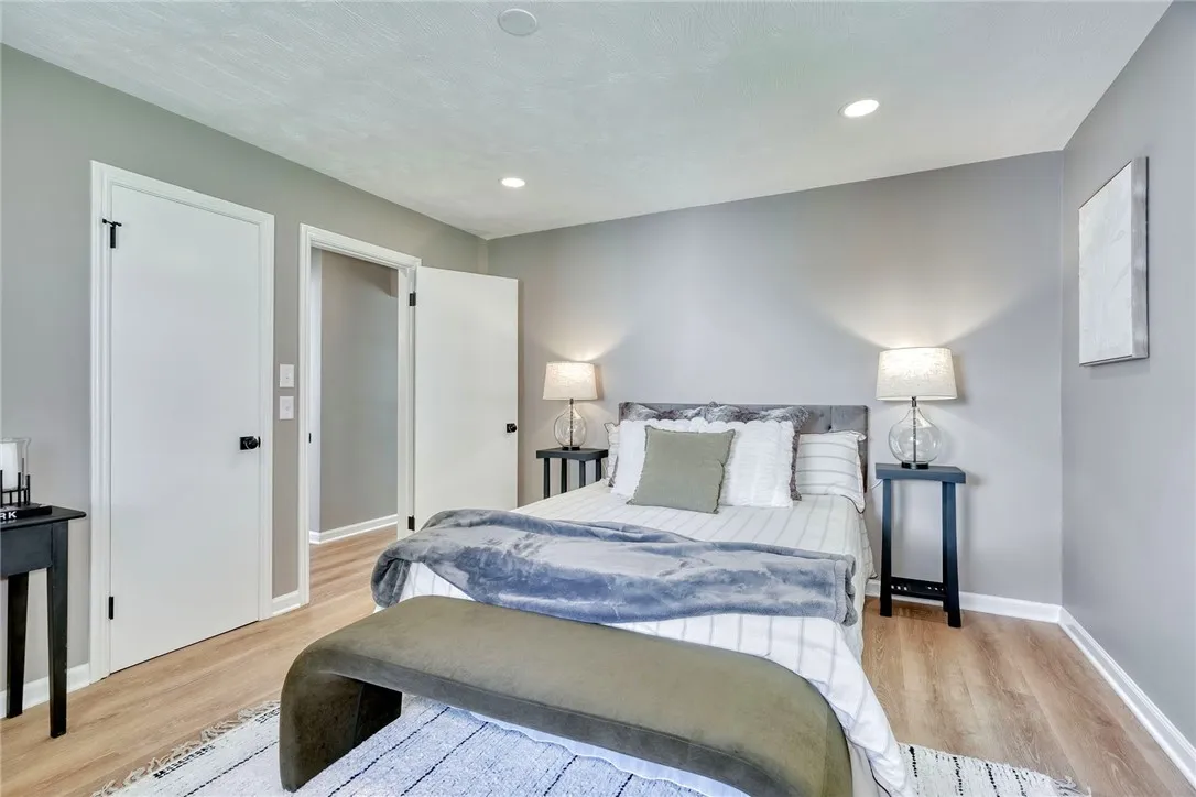 Peaceful retreat with thoughtful layout — primary on one side, secondary bedrooms on the other.