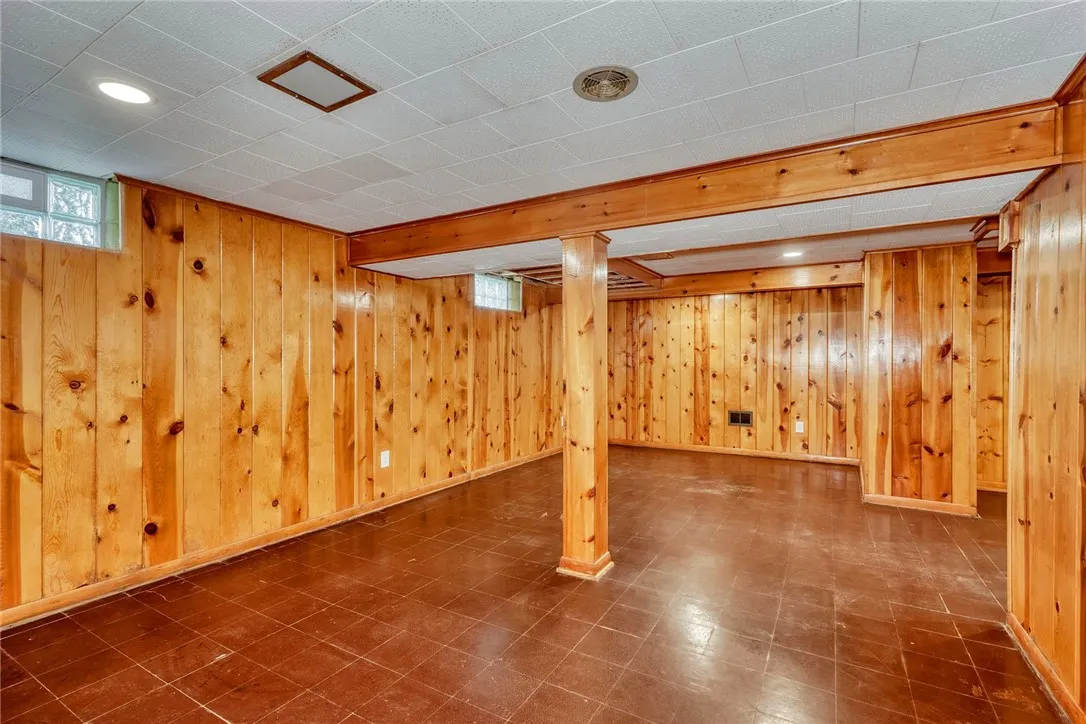 inished lower level adds bonus living space with classic knotty pine.