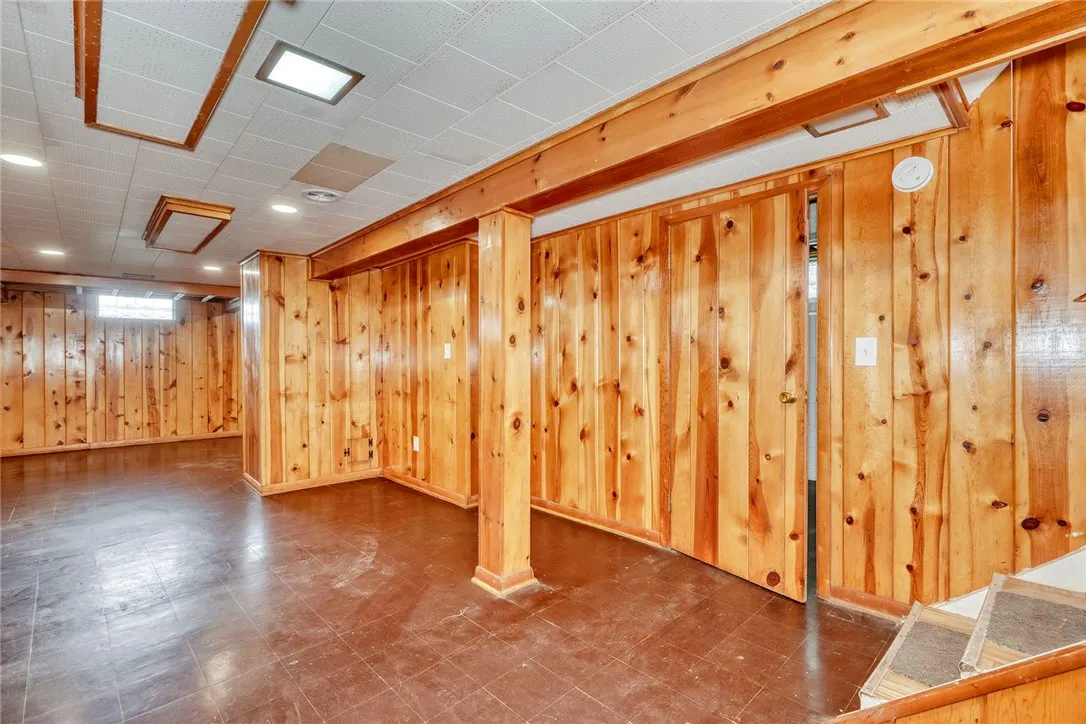 inished lower level adds bonus living space with classic knotty pine.