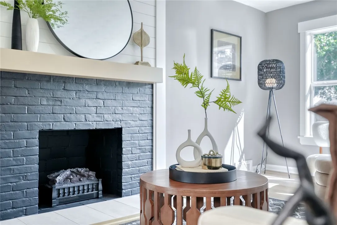 Open concept living anchored by a stylish fireplace feature wall