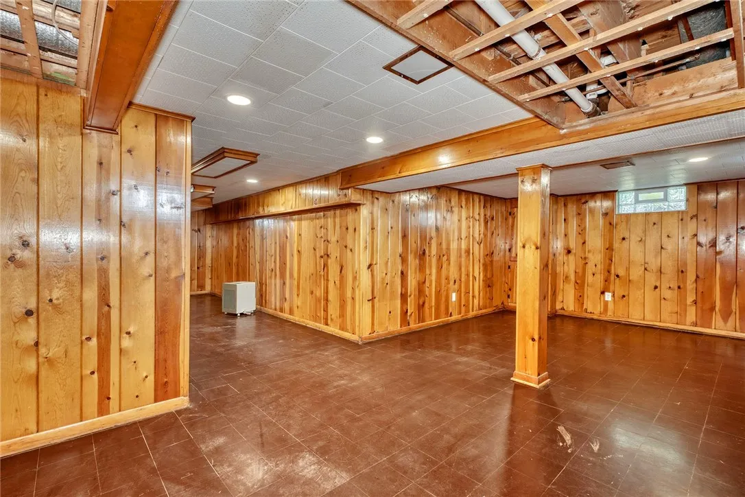 inished lower level adds bonus living space with classic knotty pine.