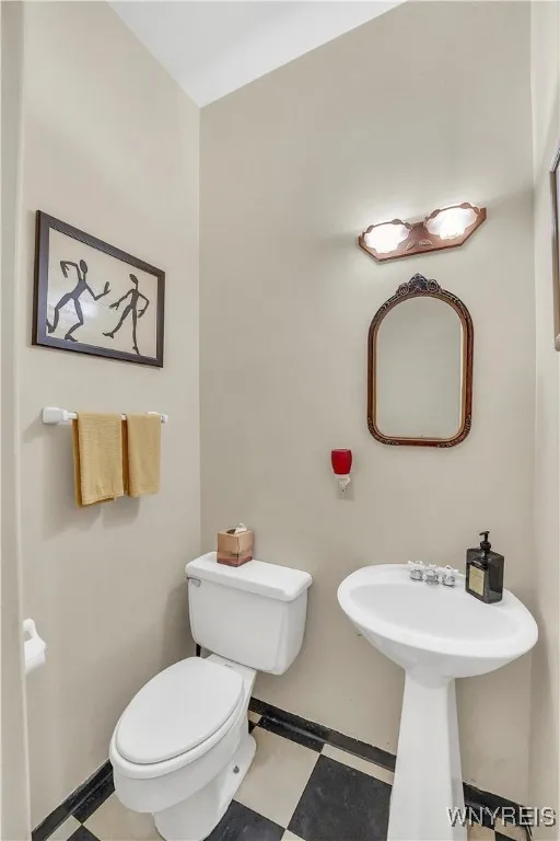 Half bath next to the laundry by the kitchen