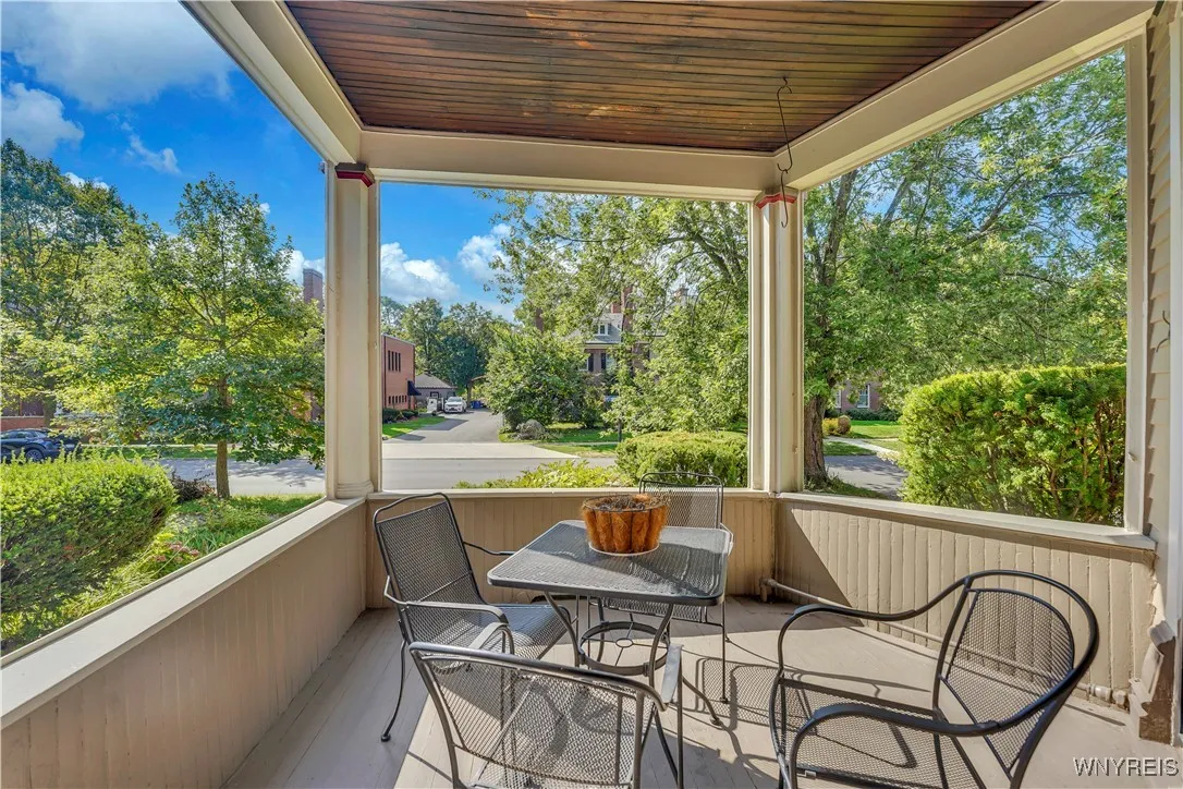 Doesn\'t this porch beg for a cup of coffee, a crossword puzzle, and some people watching?