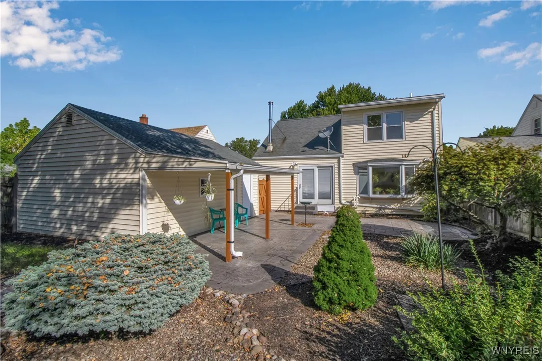 Fully fenced yard with stamped concrete patio