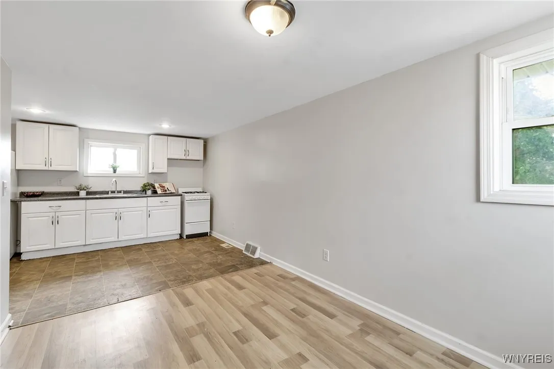 Kitchen and living room in upper right apt