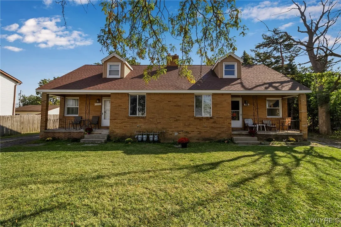 Brick side by side duplex with covered front porch