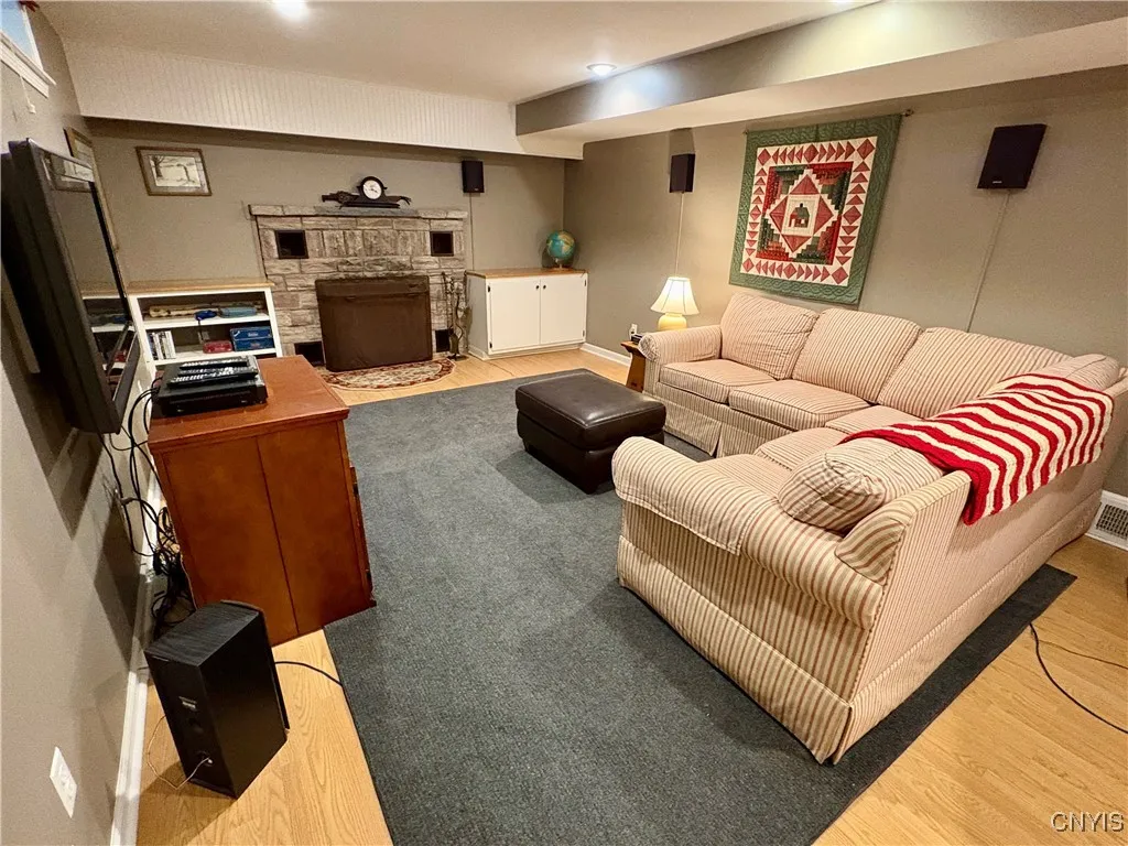 Family room with fireplace in the lower level.