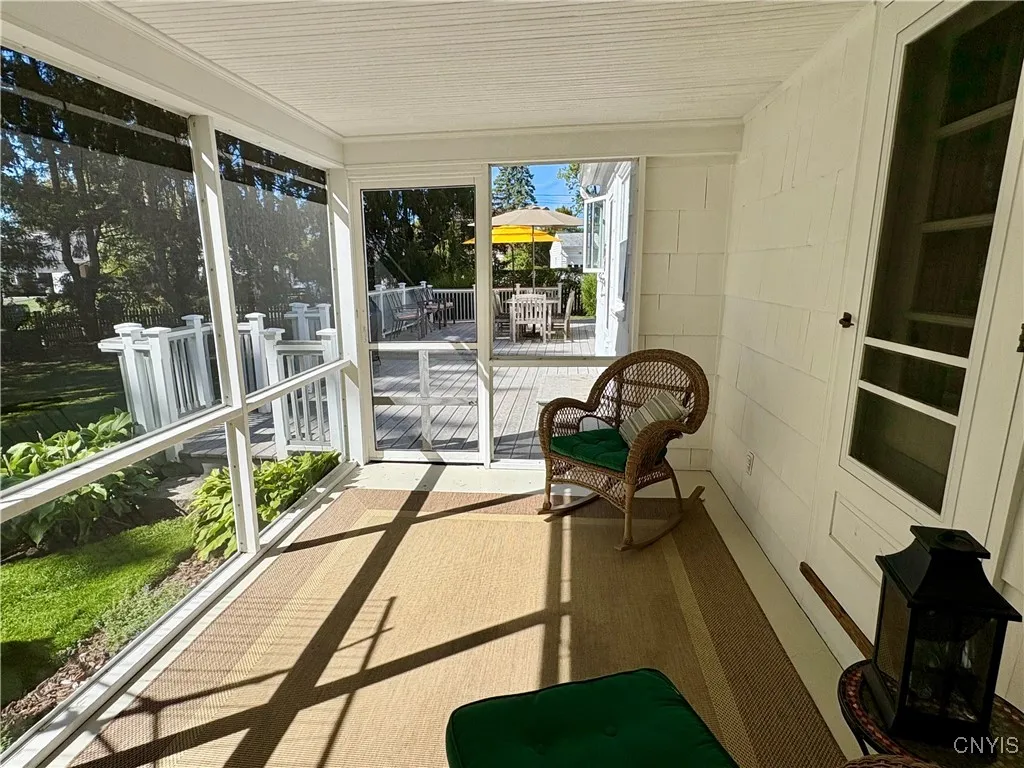 Screened porch off the dining room with access to the deck.