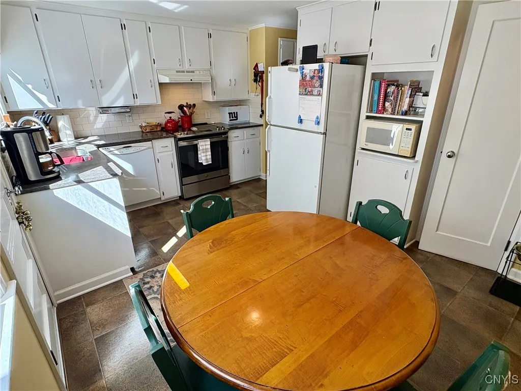 Walk-in pantry next to the fridge.