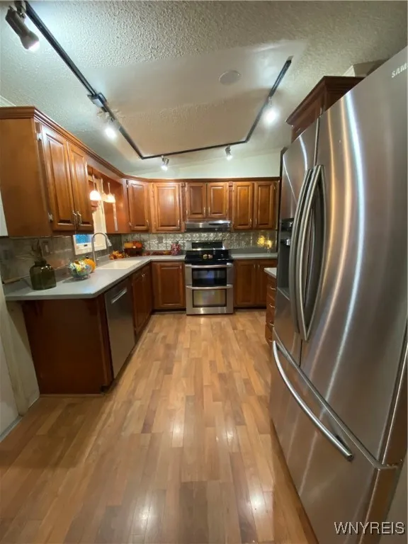 Beautiful Luxury Wood Laminate floors in Kitchen and DR