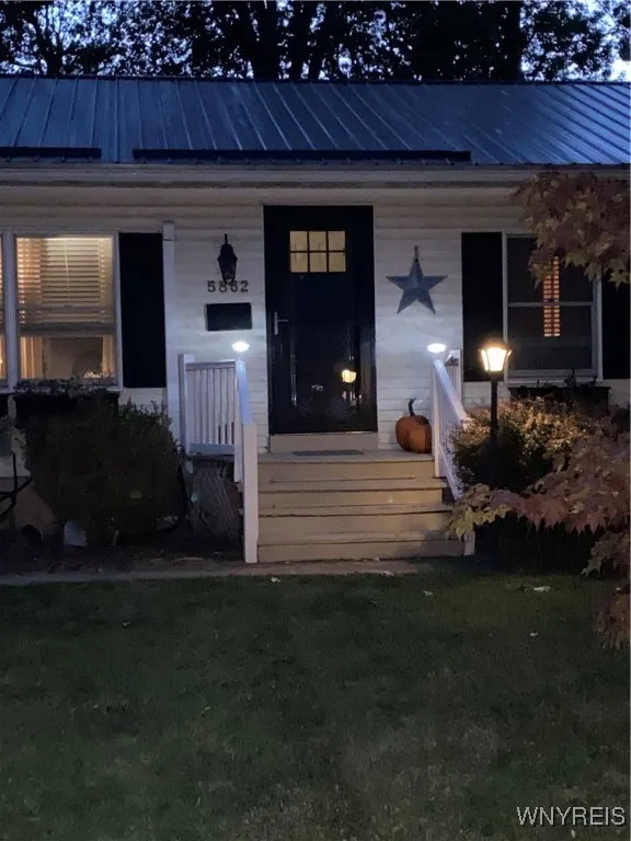 Night view highlighting solar lights on porch posts
