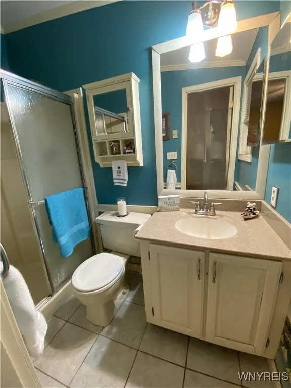 Primary Bathroom with walk-in shower and corian counter top