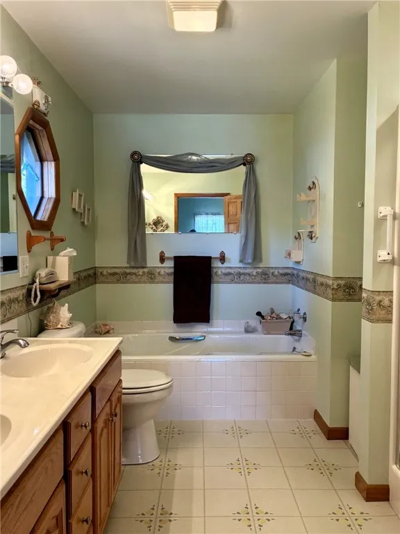 The en-suite bathroom has a jetted tub, separate shower, double sinks and plenty of storage.