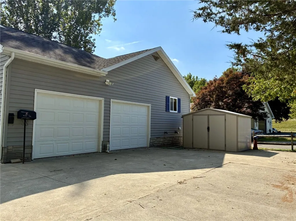The double-wide driveway is perfect for all of your guests and you also have a 2-car attached garage. The garage has workspace and storage room. If you need more storage, this nice vinyl shed comes with the sale!
