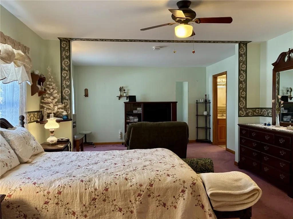 This view shows the primary bedroom, sitting area and bathroom. Now this is comfort!