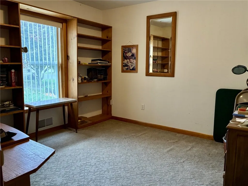 Guest bedroom 1 has built-in shelving that flank the window so they don't take up much of the floor space. This is a really nice feature!