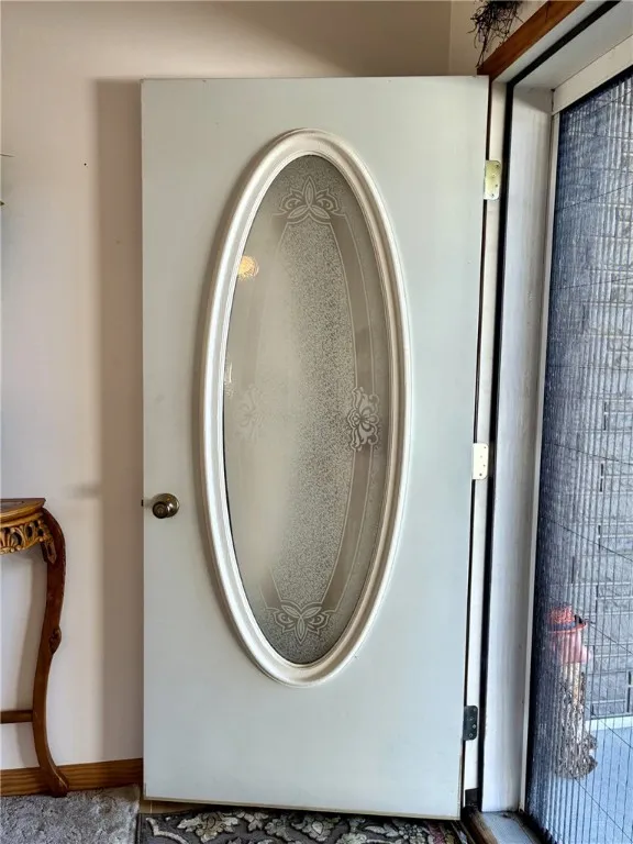 This pretty etched oval lite glass door adds a touch of class. The unique screen door retracts to the side and is completely concealed if you need it to be.