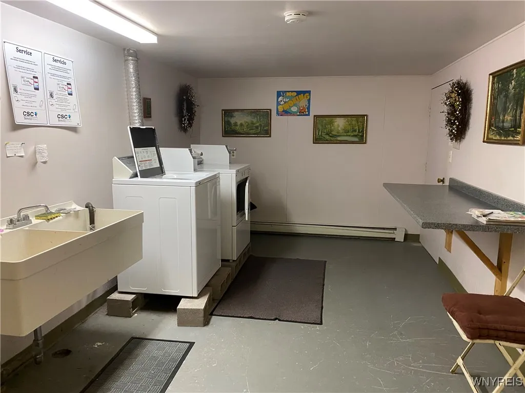 Laundry facility's in the basement Coin op washer and dryer.